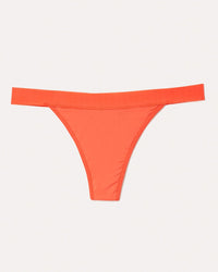 Joyja Leah period-proof panty in color Living Coral and shape thong