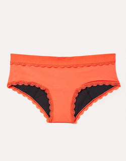 Joyja Olivia period-proof panty in color Living Coral and shape hipster